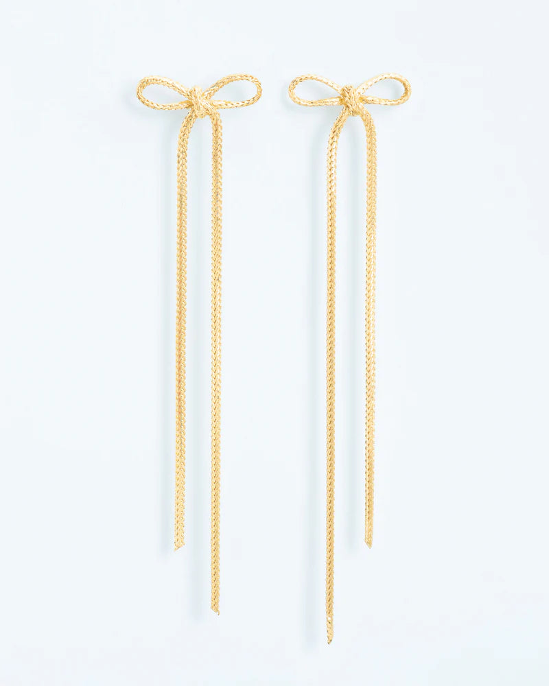 Textured stud earrings with statement bow