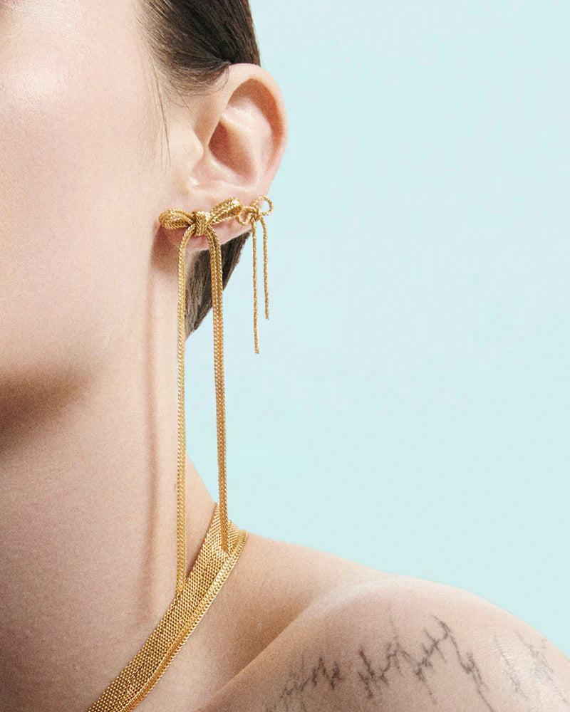 Textured stud earrings with small bow