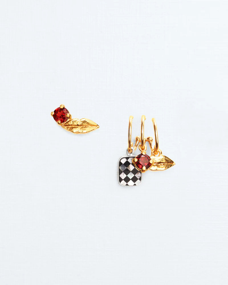 Trompe l'oeil earrings with lip, chess mosaic and garnet