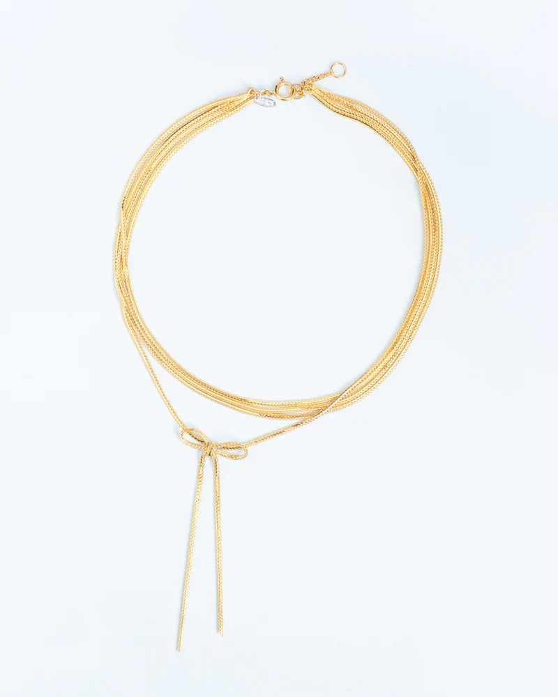 Layered necklace with statement bow