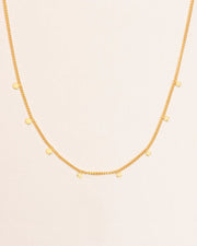 Necklace with hammered charms in 18 ct. gold