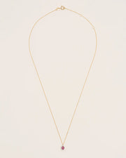 Necklace with oval ruby and diamond halo in 18 ct. gold