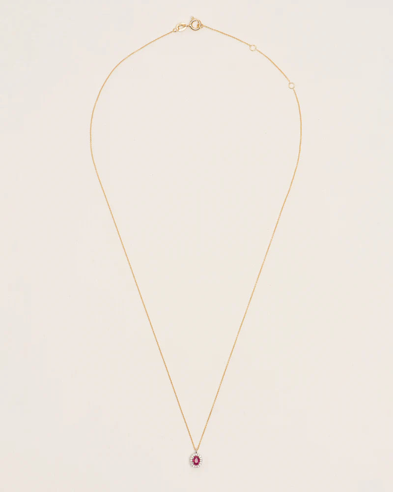 Necklace with oval ruby and diamond halo in 18 ct. gold