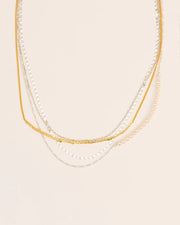 Layered necklace with branch element, chains and pearls string