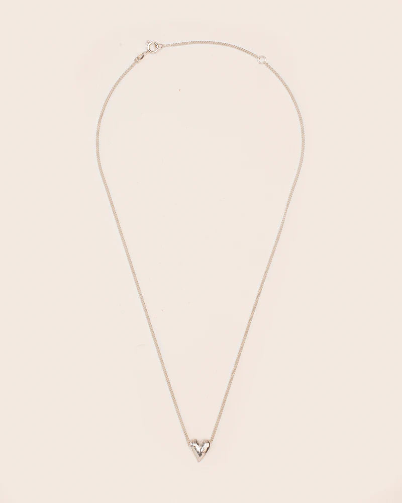Necklace with heart-shaped hammered pendant
