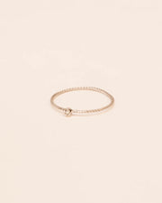 Twisted ring with white diamond in 18 ct. gold