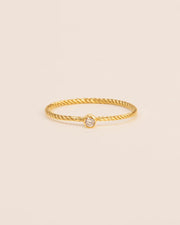 Twisted ring with white diamond in 18 ct. gold