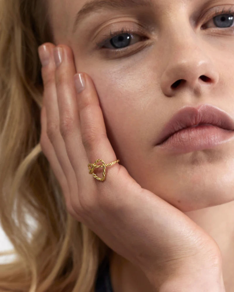 Intricate knotted heart ring