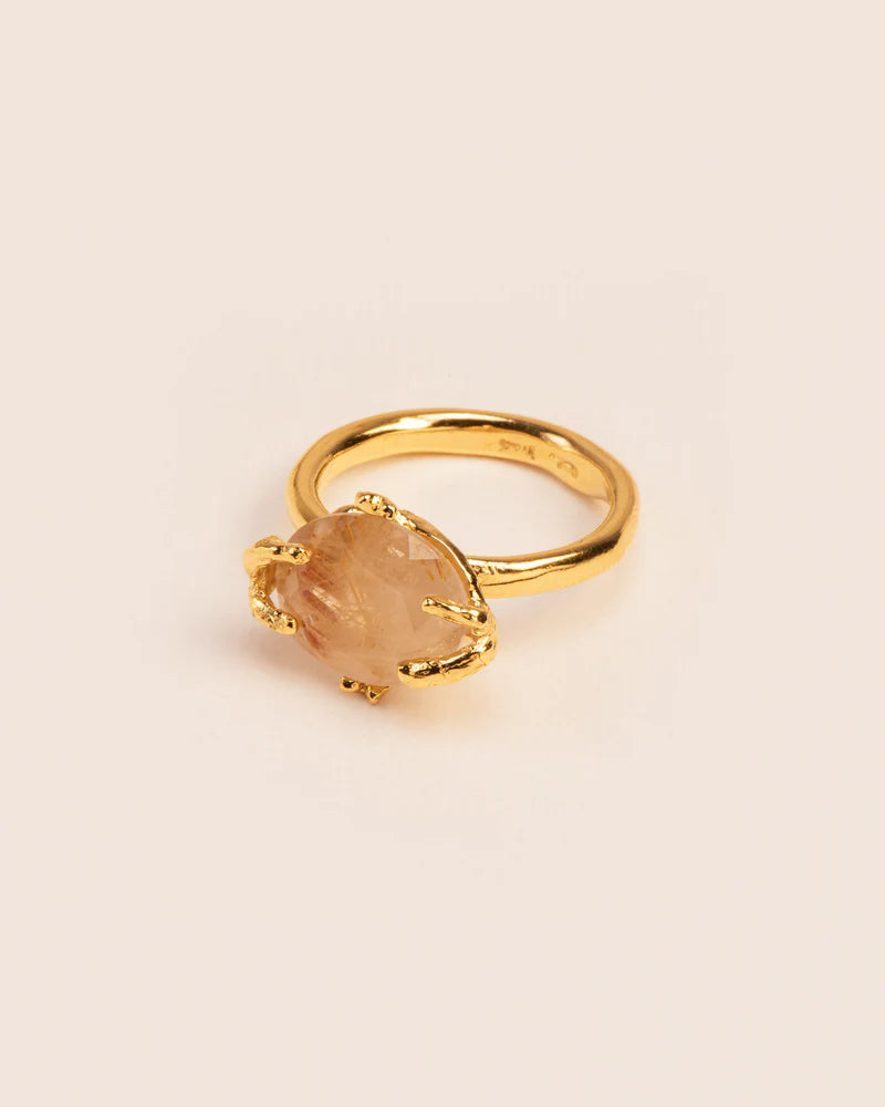 Organic ring with rutilated quartz