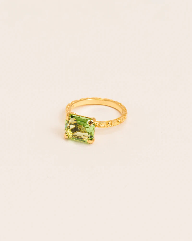 Ring with 'Chapters' texture and peridot crystal